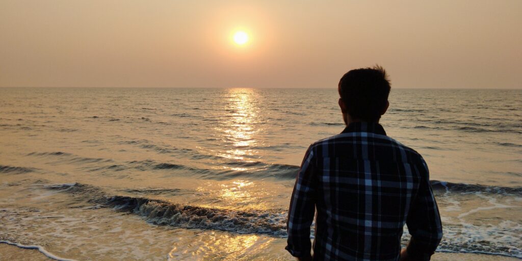 Pravasea enjoying the view of sunset,  at Tithal beach
